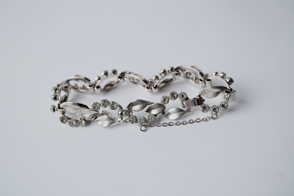 Vintage silver-tone bracelet with leaf design and rhinestones