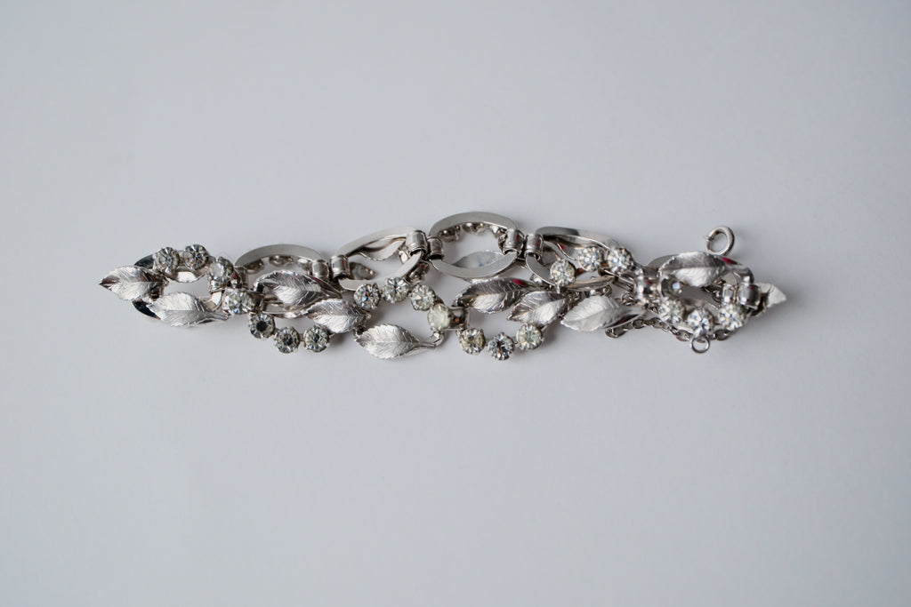 Vintage silver-tone bracelet with leaf design and rhinestones