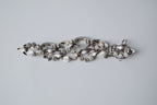 Vintage silver-tone bracelet with leaf design and rhinestones