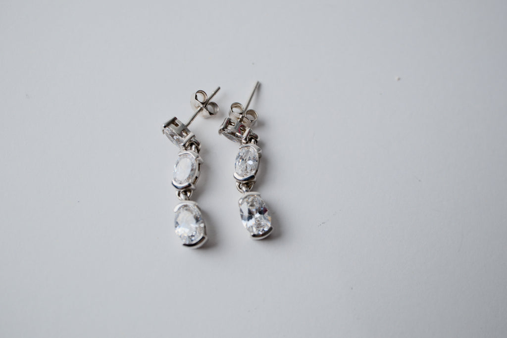 Sterling silver three-stone oval drop earrings