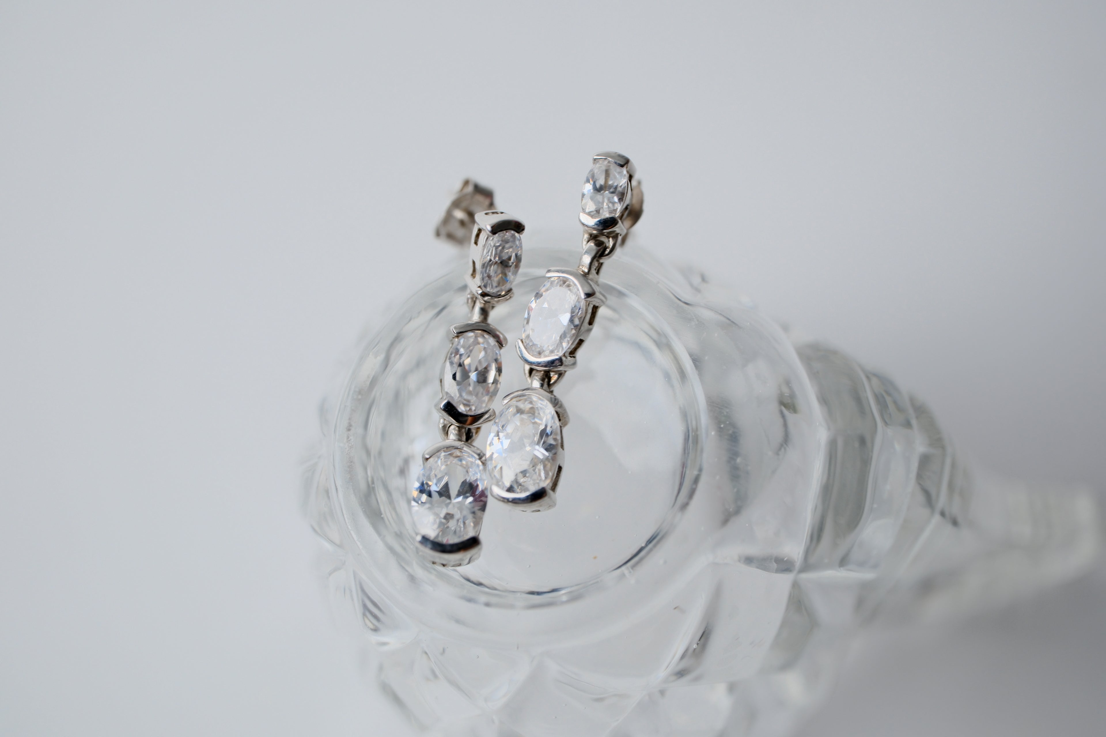 Sterling silver three-stone oval drop earrings