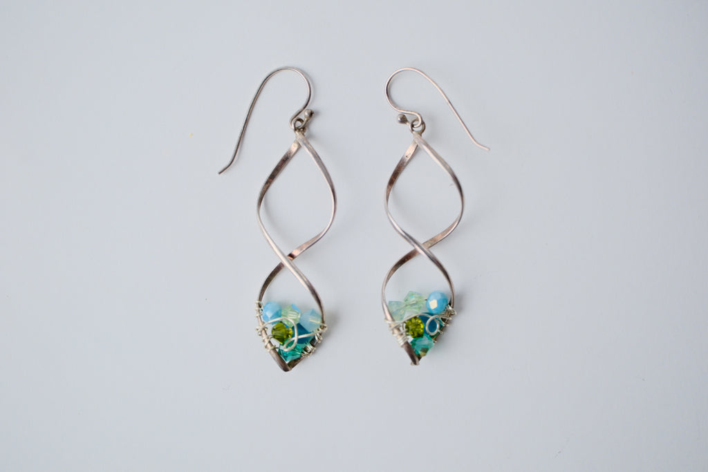 Sterling silver spiral wire earring with multi-blue beads