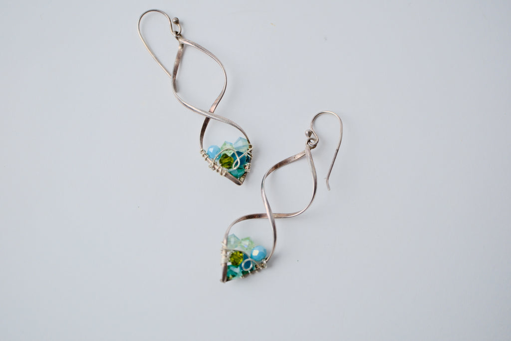 Sterling silver spiral wire earring with multi-blue beads