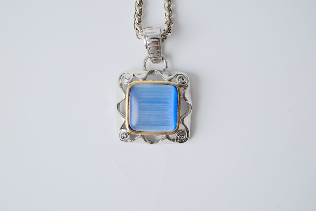 Silver toned chain with translucent blue stone