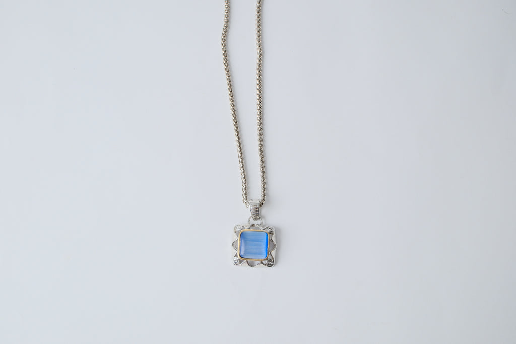Silver toned chain with translucent blue stone