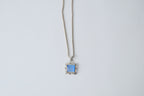 Silver toned chain with translucent blue stone