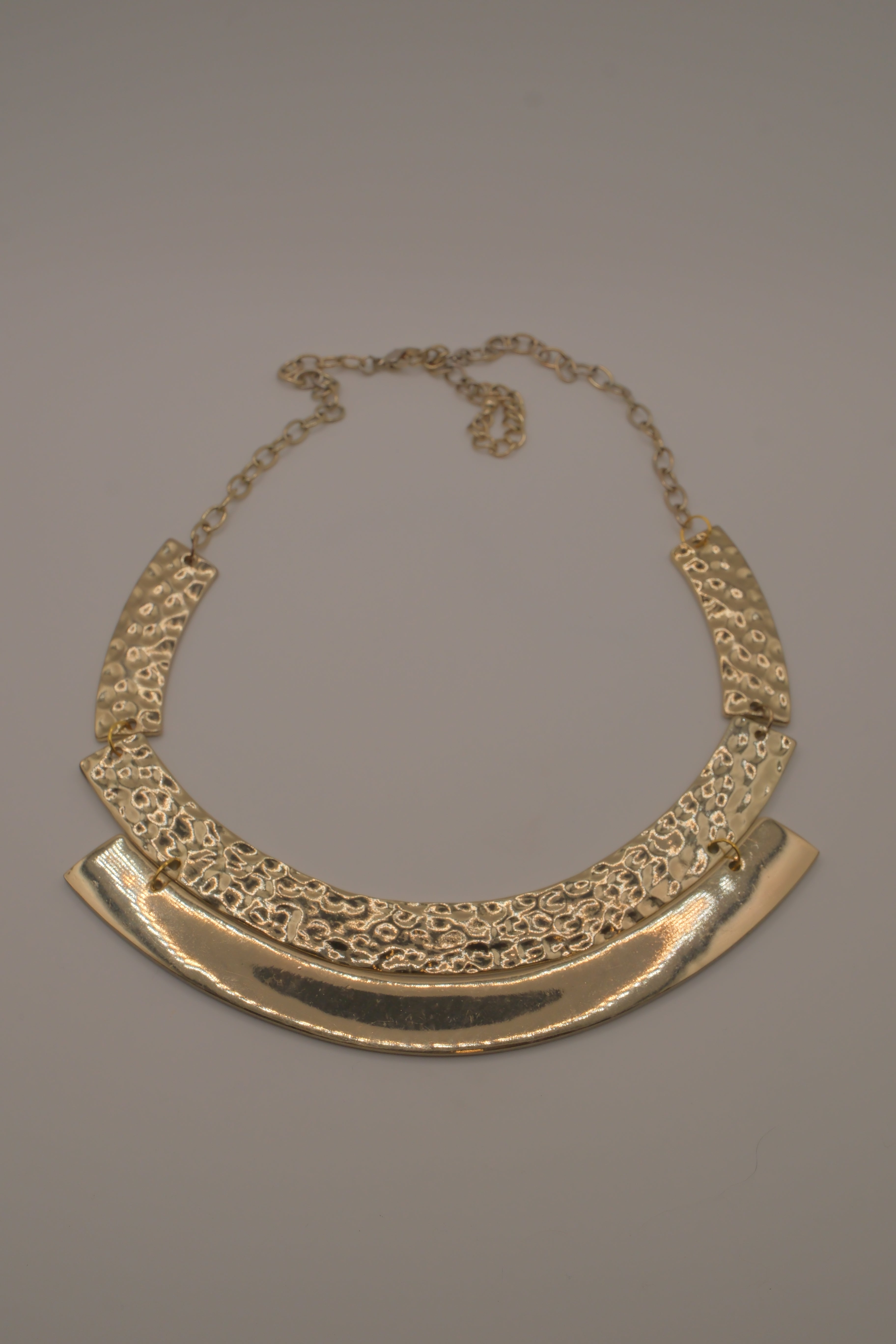 Gold-tone textured metal collar necklace
