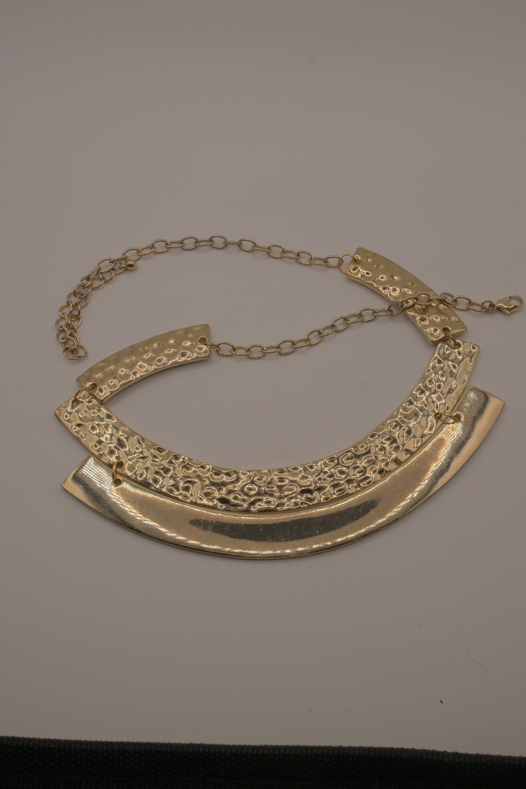 Gold-tone textured metal collar necklace