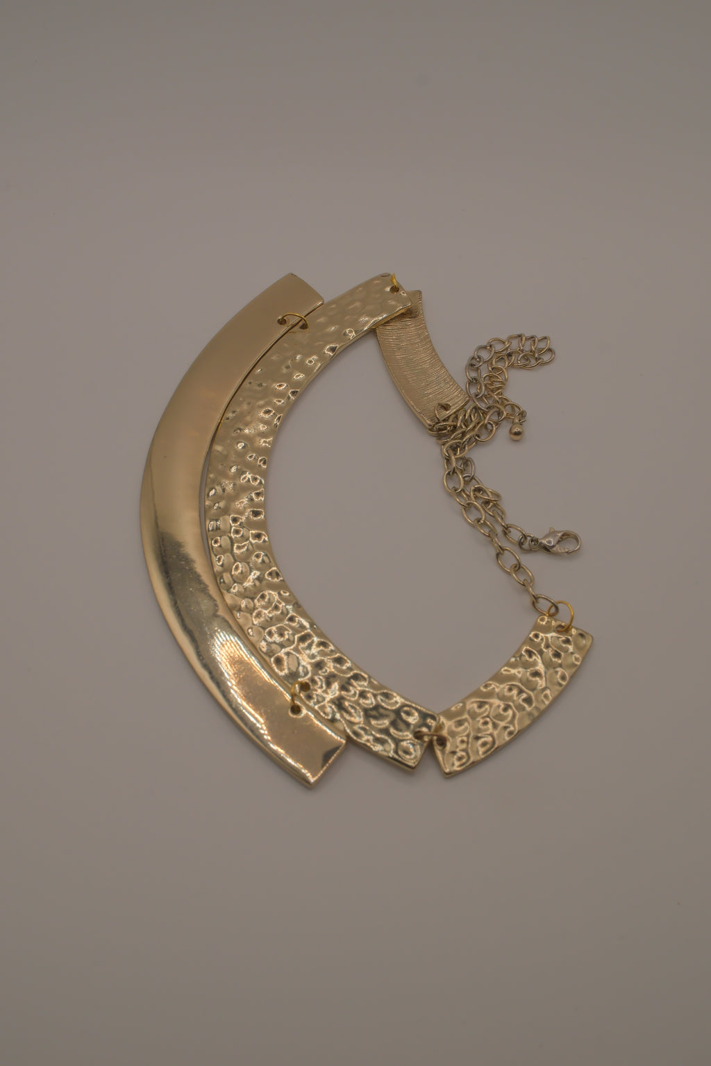 Gold-tone textured metal collar necklace
