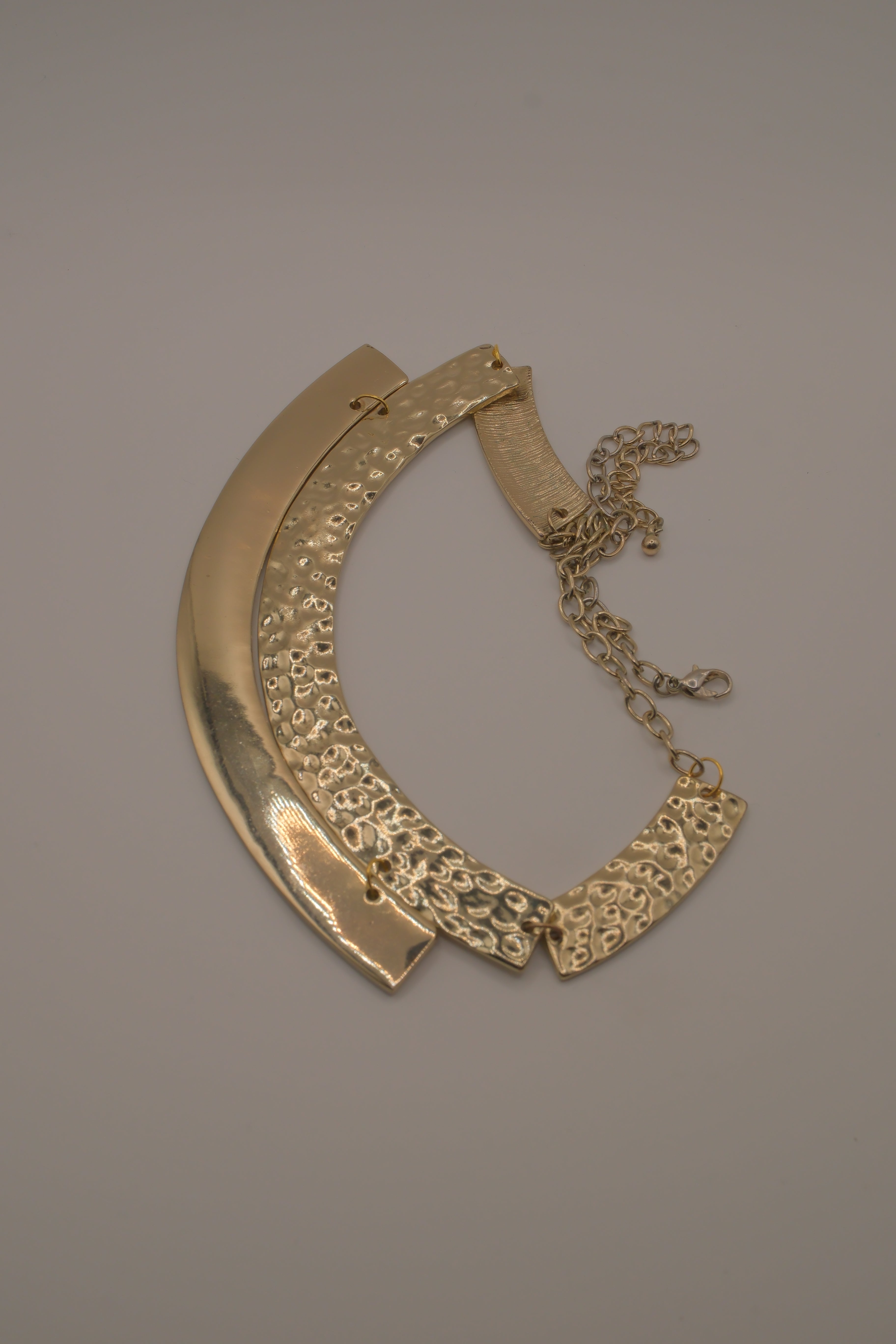 Gold-tone textured metal collar necklace