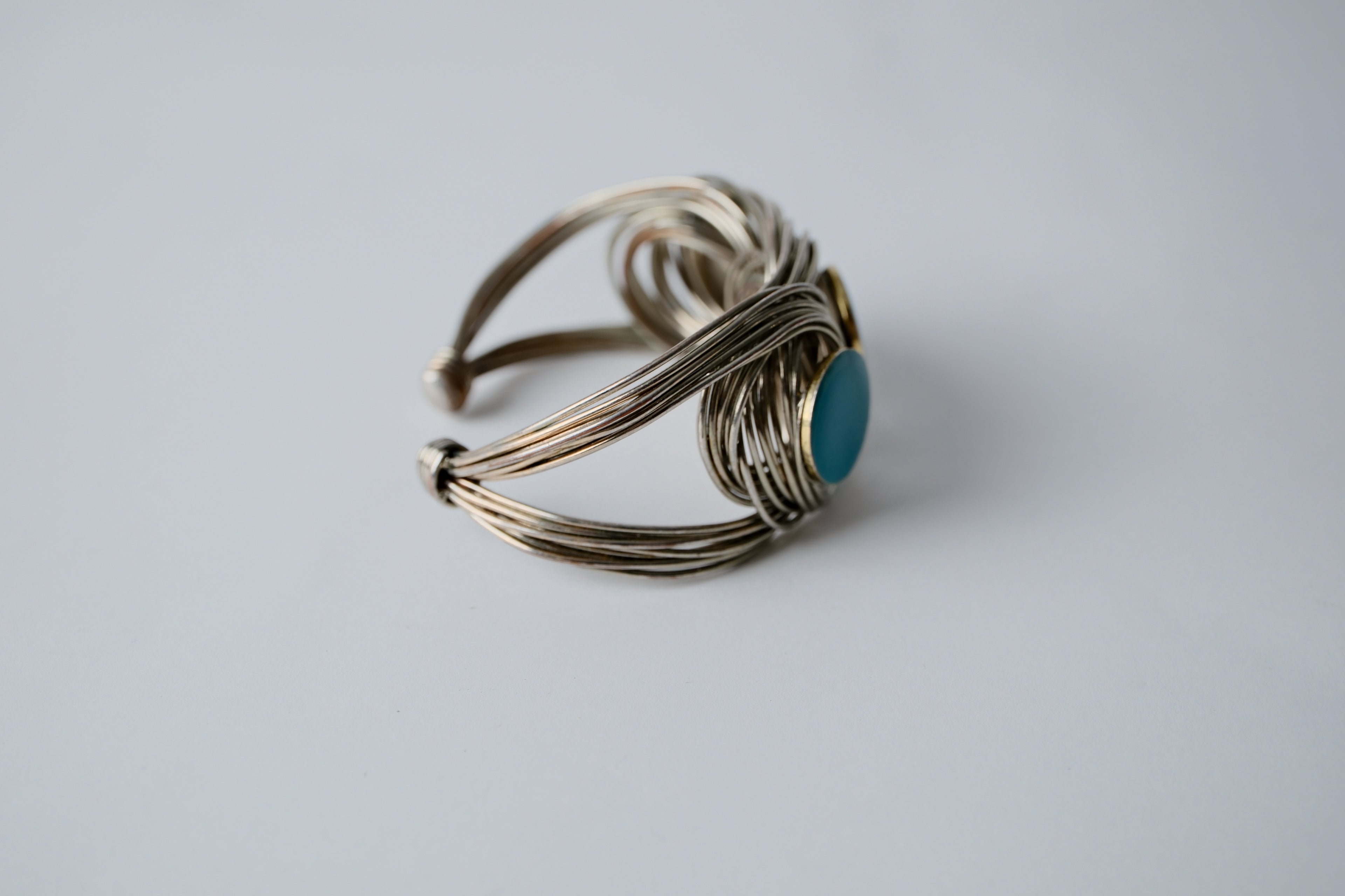 Woven wire cuff bracelet with faux turquoise