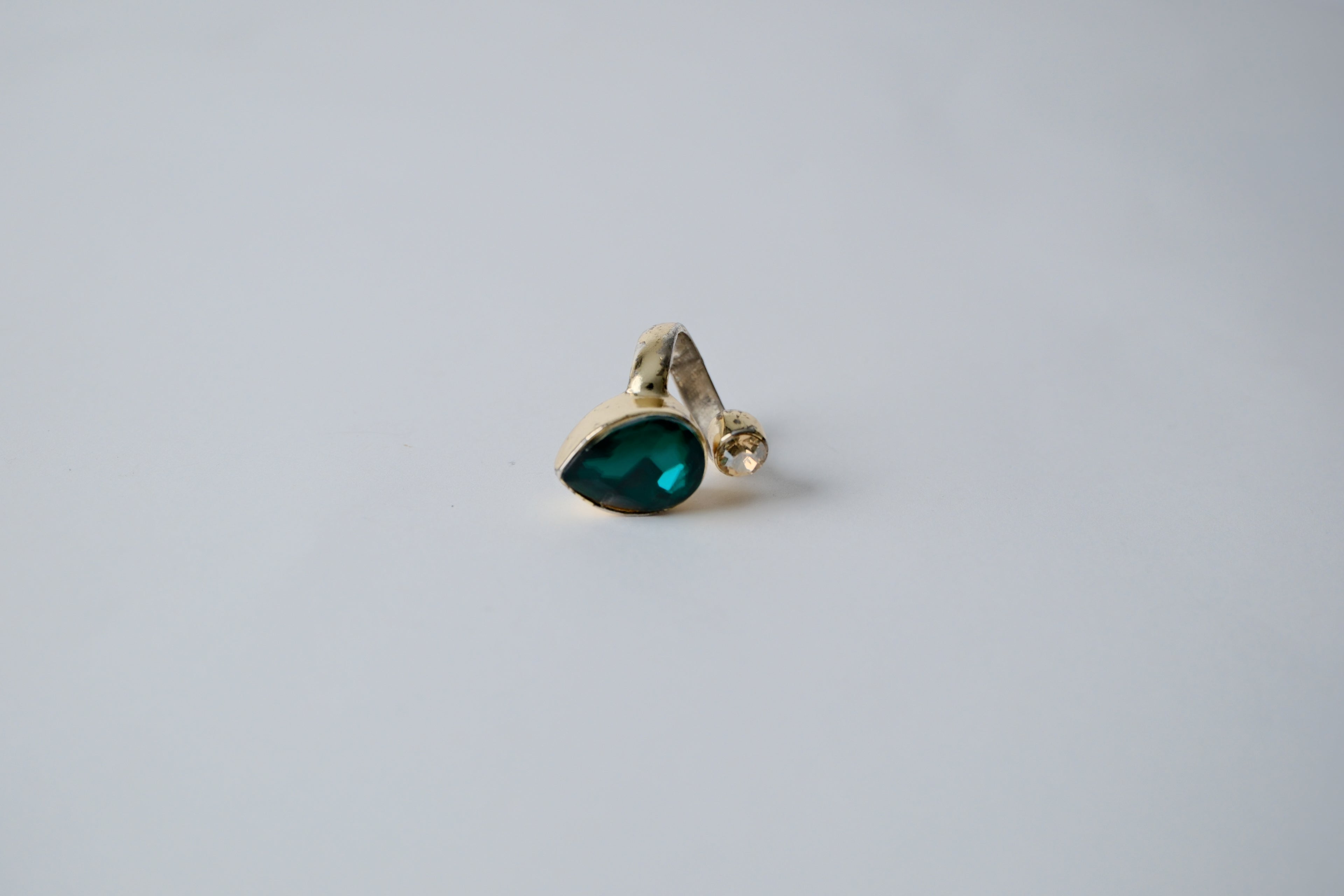 Teardrop-shaped green stone with cubic zirconia Ring