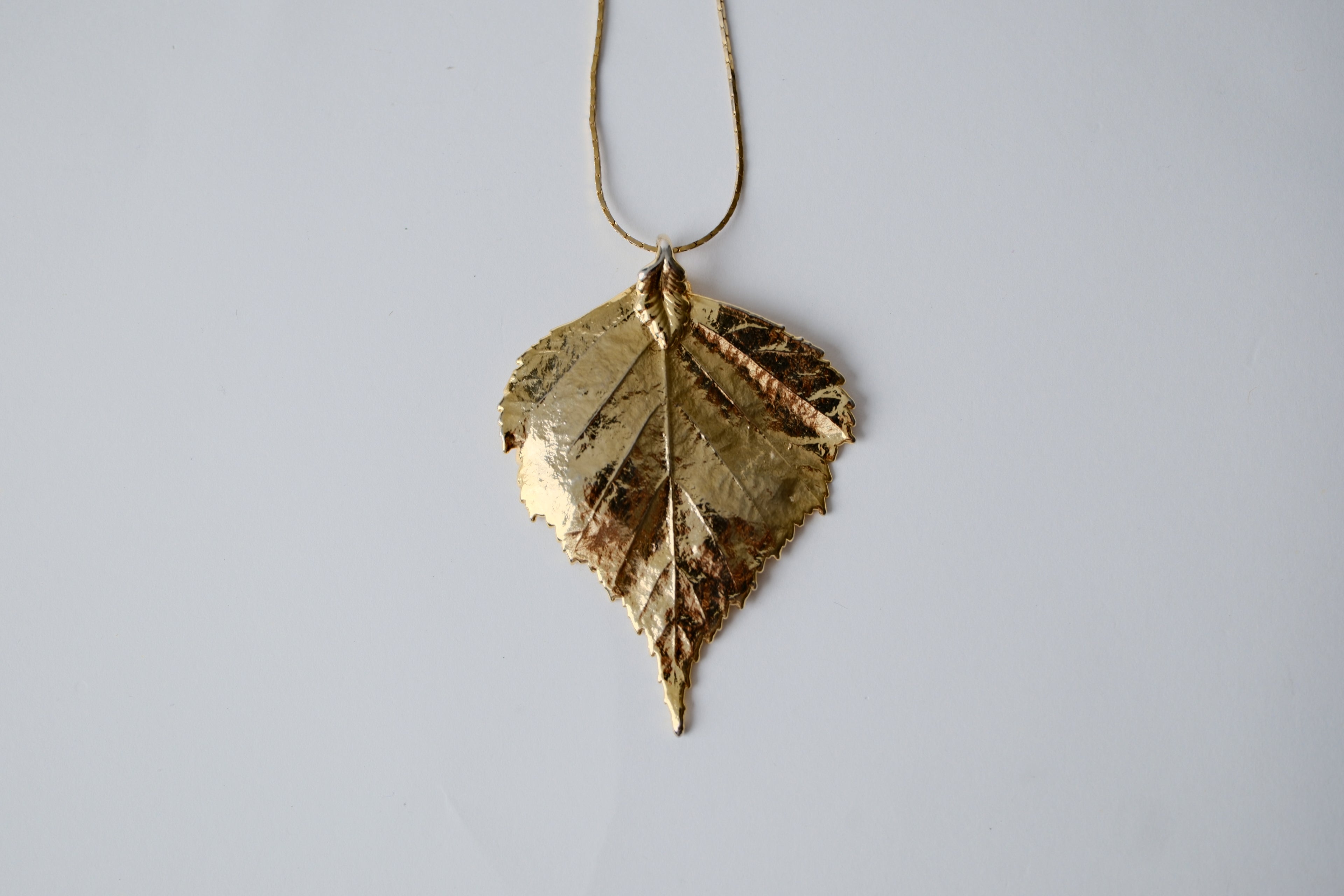 Gold Toned Leaf Pendant Necklace