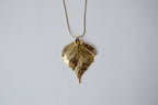 Gold Toned Leaf Pendant Necklace
