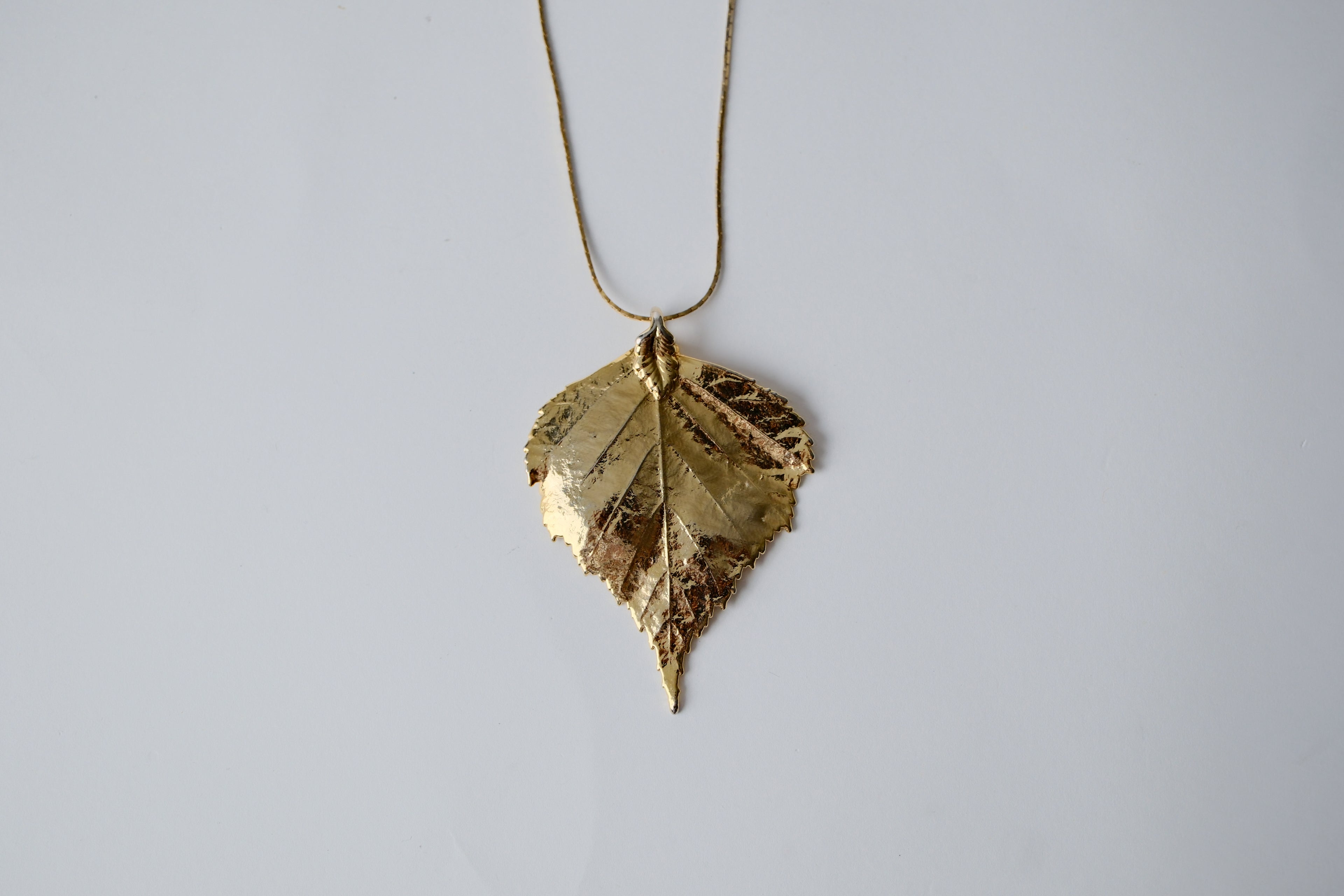 Gold Toned Leaf Pendant Necklace