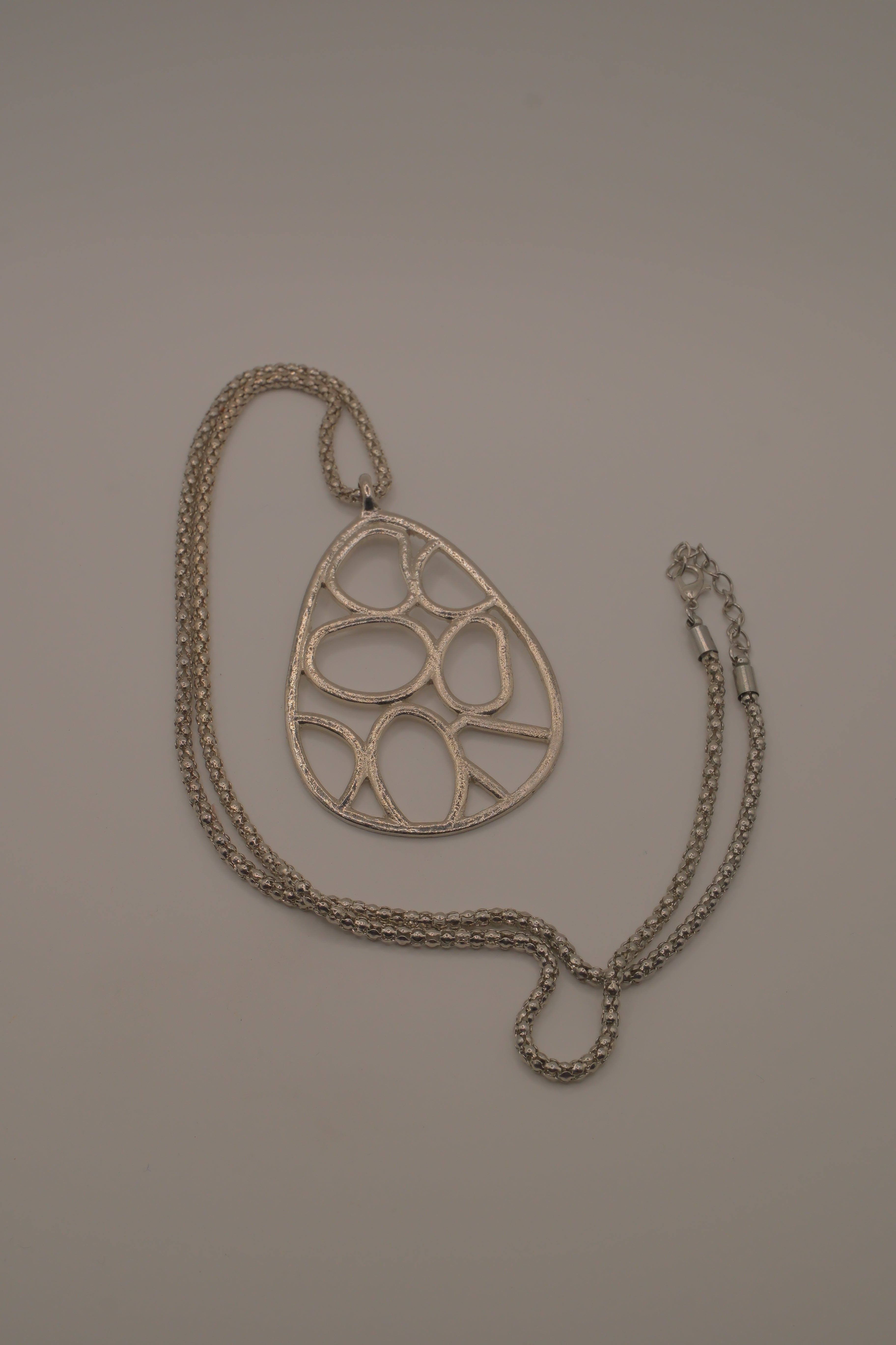 Organic geometric cutout teardrop pendant Necklace