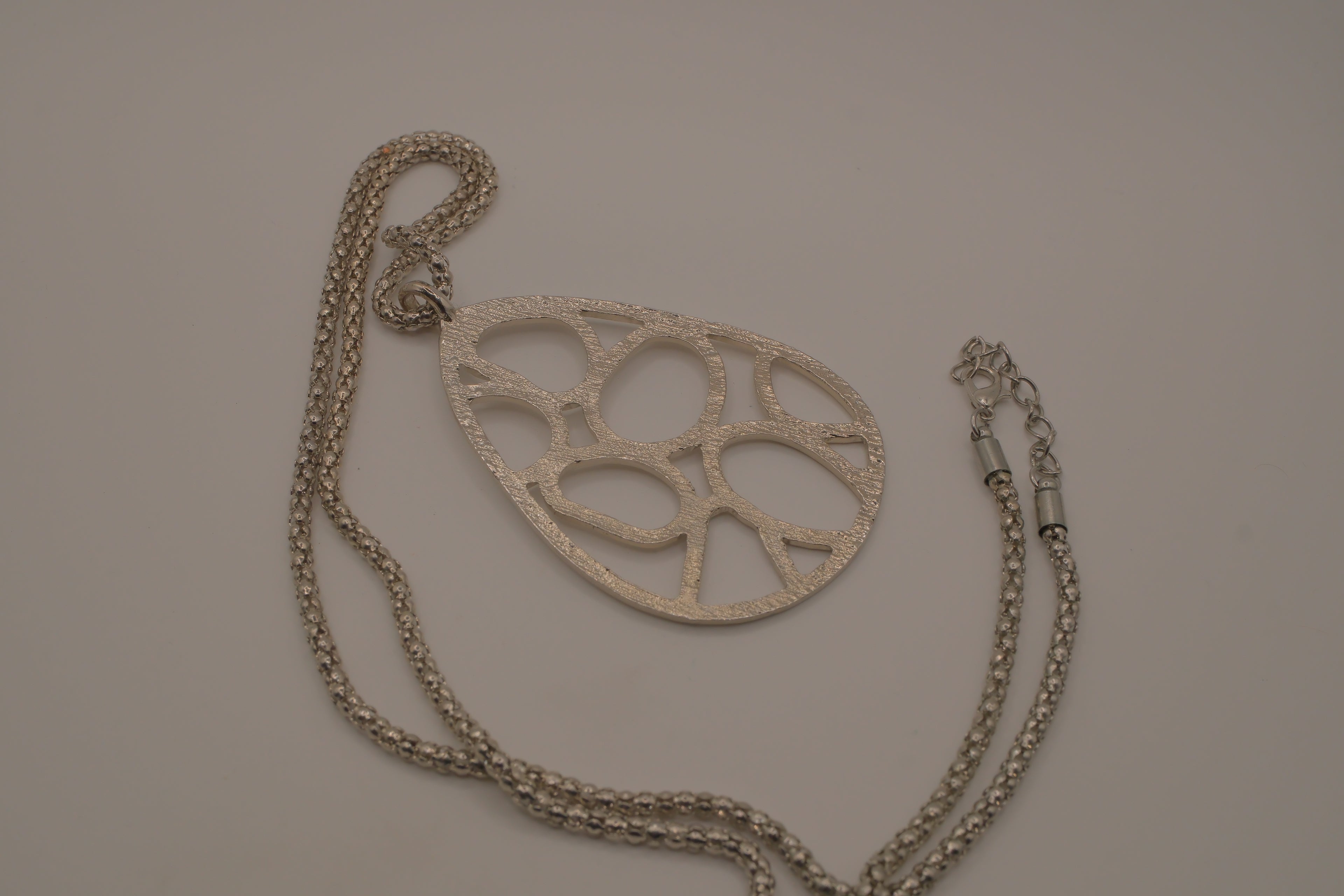 Organic geometric cutout teardrop pendant Necklace