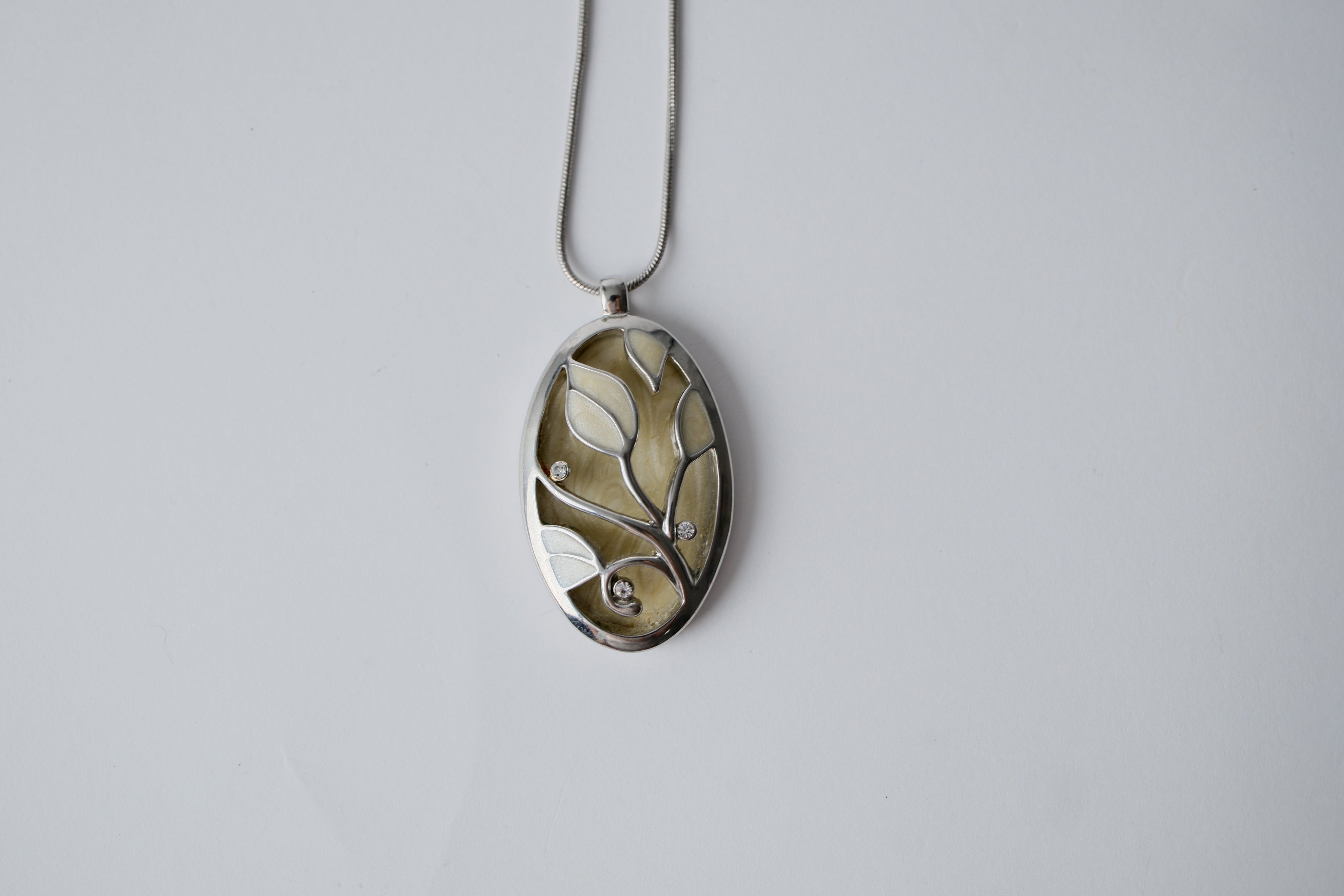 Ivory-colored enamel pendant necklace
