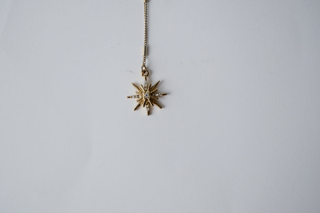 Gold toned Star shaped Y necklace