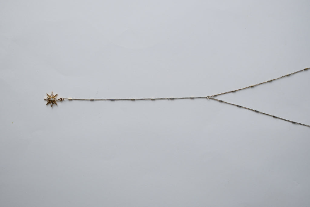 Gold toned Star shaped Y necklace