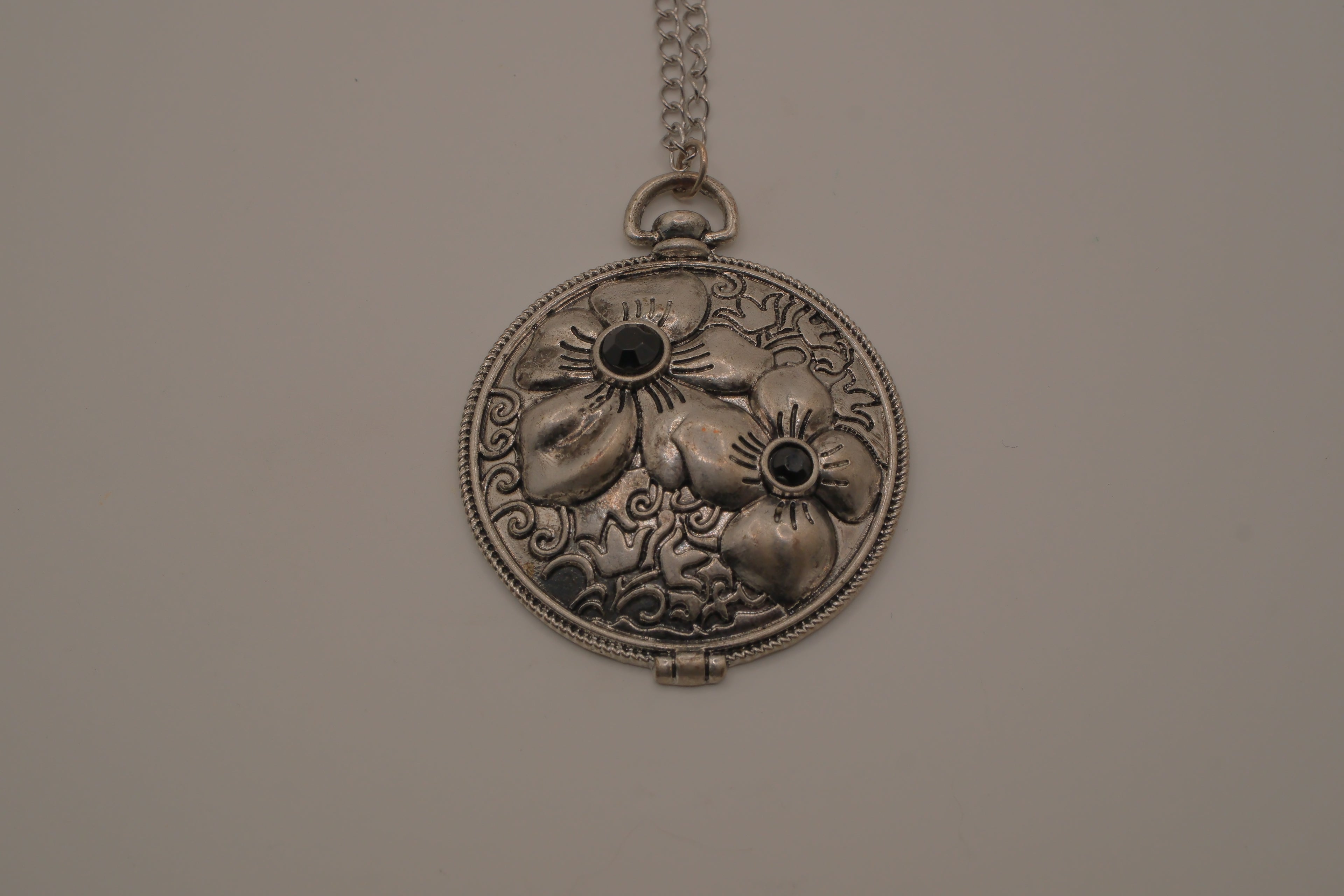 Antiqued silver-tone floral pendant