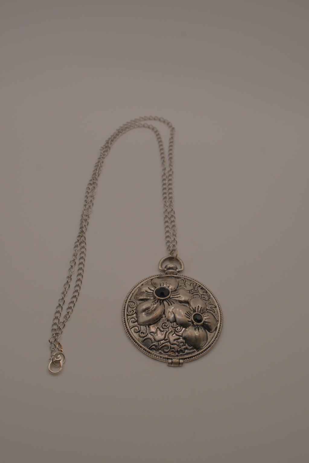Antiqued silver-tone floral pendant