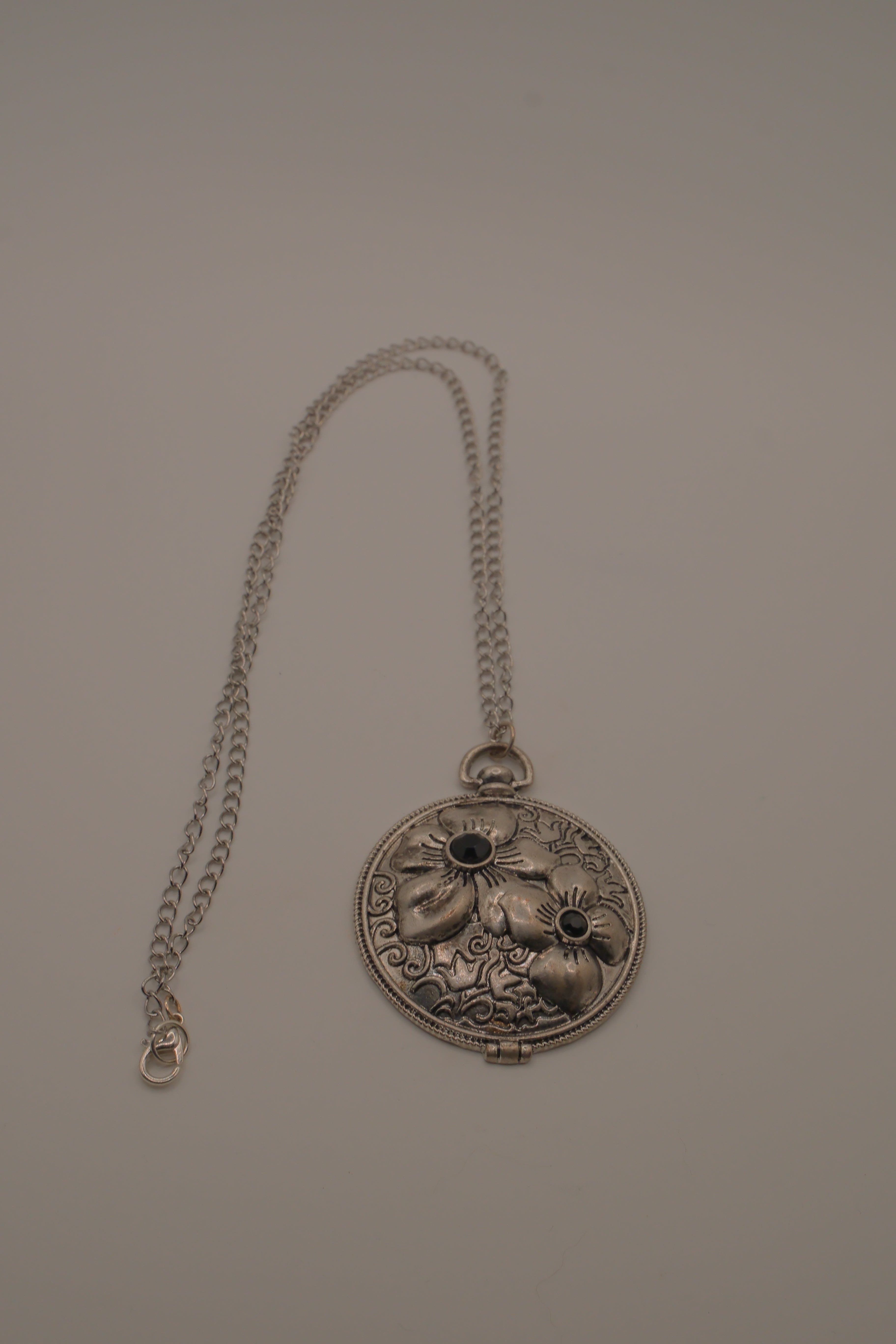 Antiqued silver-tone floral pendant
