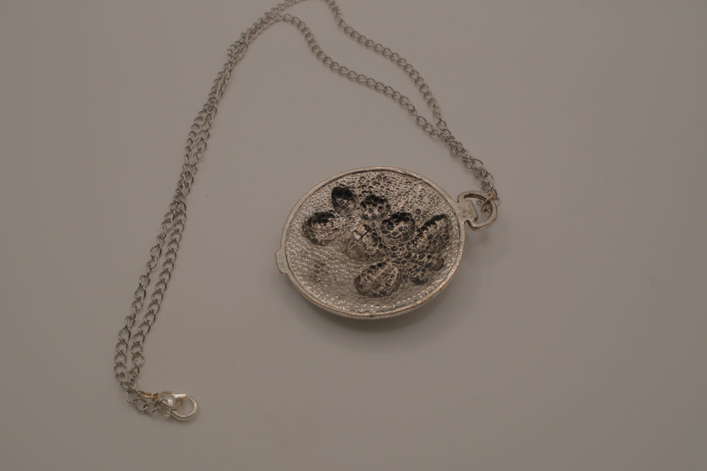 Antiqued silver-tone floral pendant