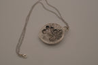 Antiqued silver-tone floral pendant
