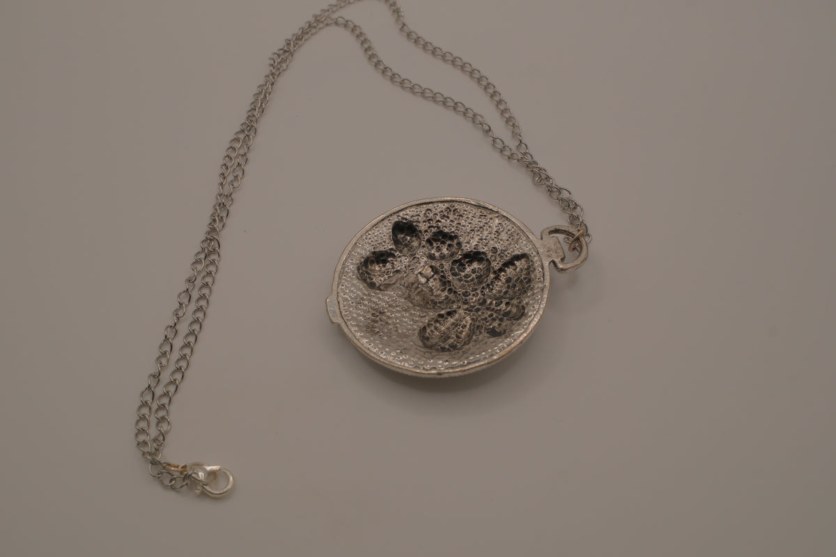Antiqued silver-tone floral pendant