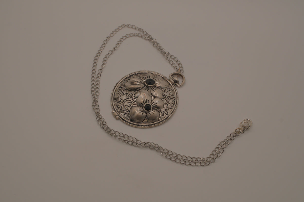 Antiqued silver-tone floral pendant