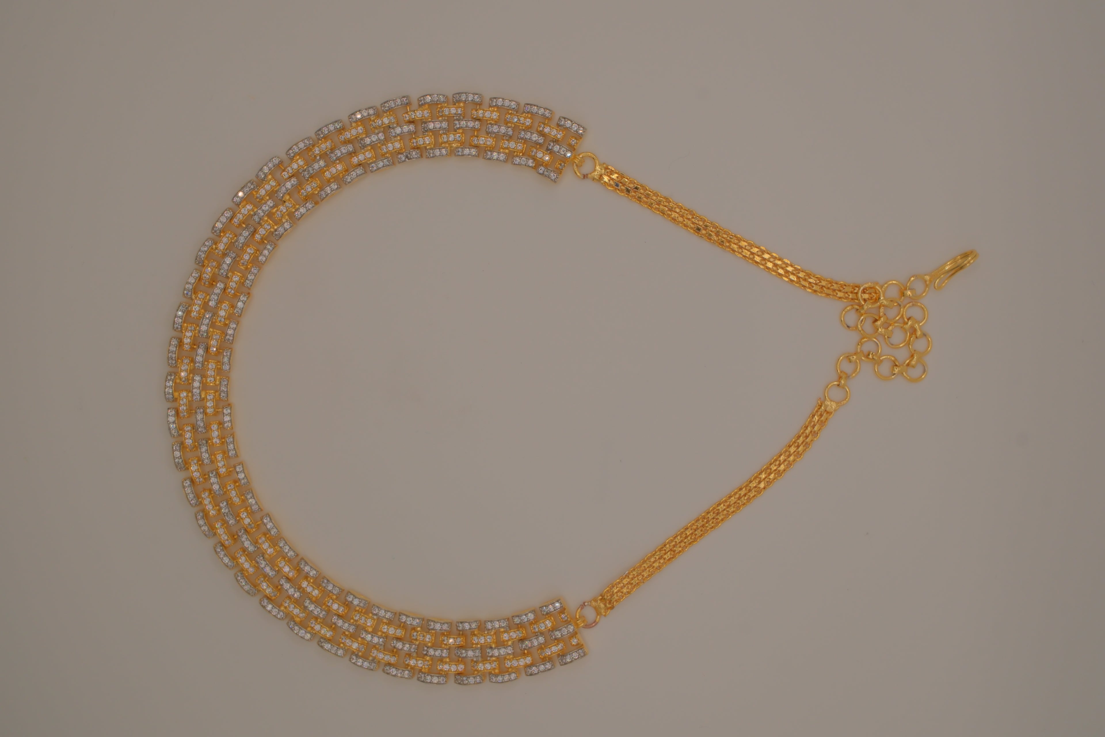 Multi-layered gold and cubic zirconia stones collar necklace