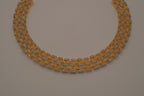 Multi-layered gold and cubic zirconia stones collar necklace