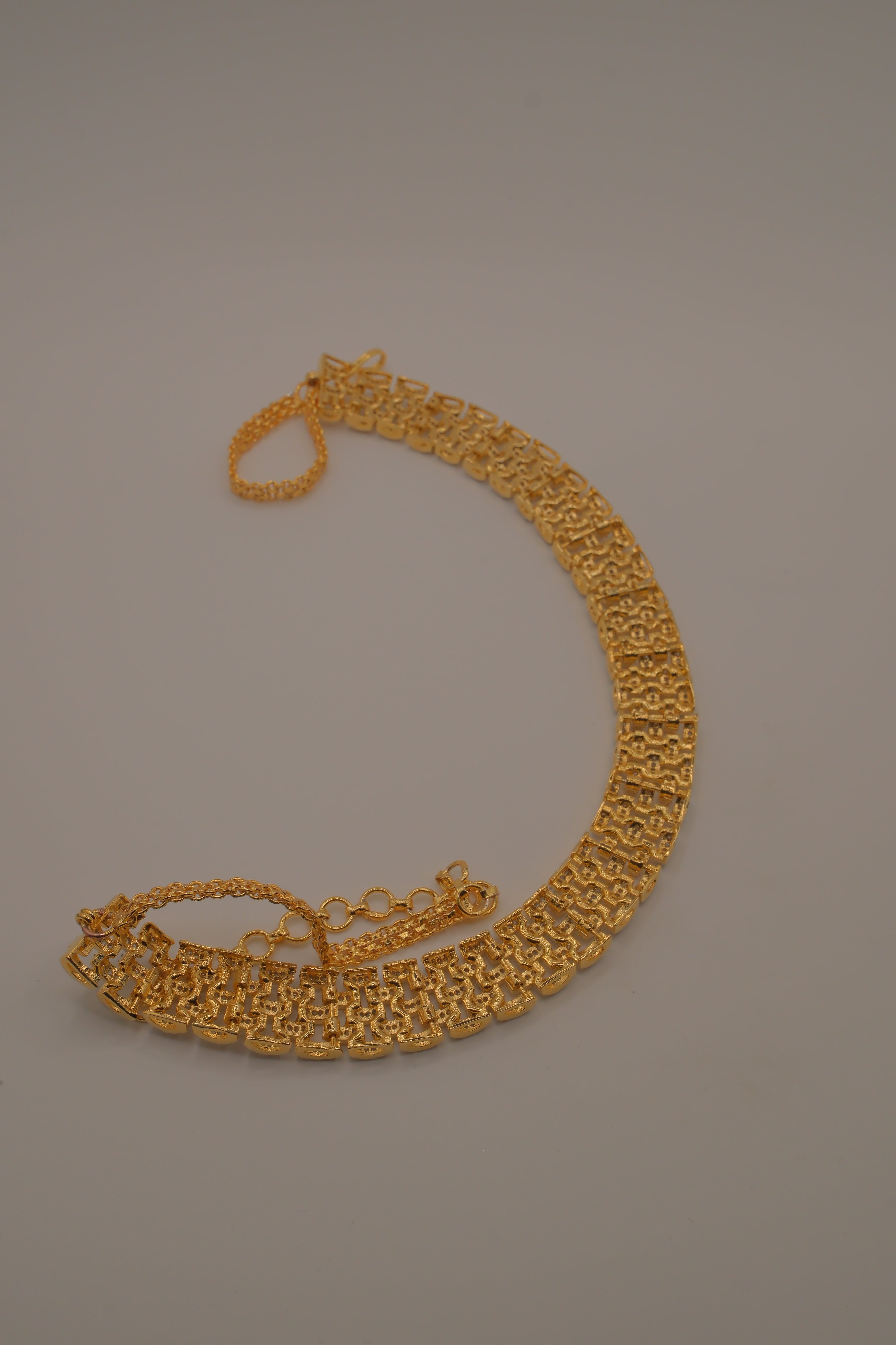 Multi-layered gold and cubic zirconia stones collar necklace