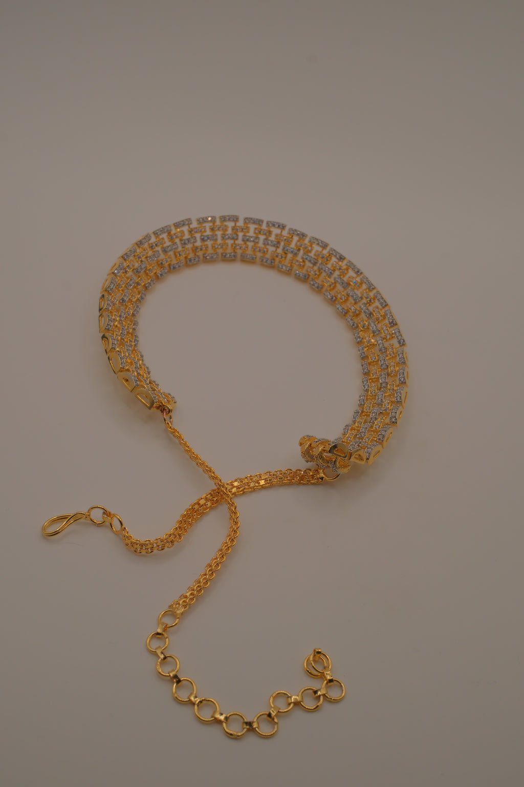 Multi-layered gold and cubic zirconia stones collar necklace