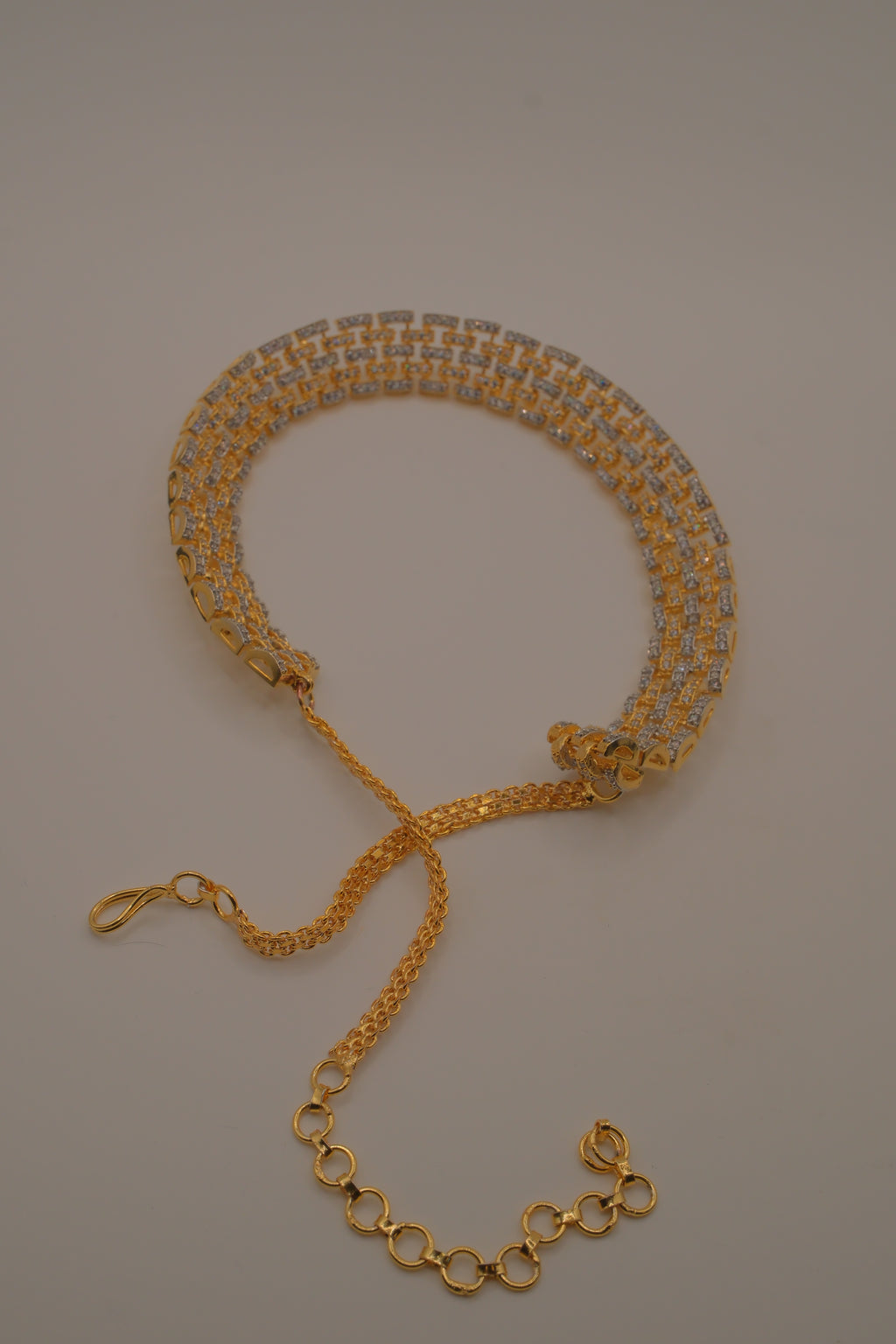 Multi-layered gold and cubic zirconia stones collar necklace