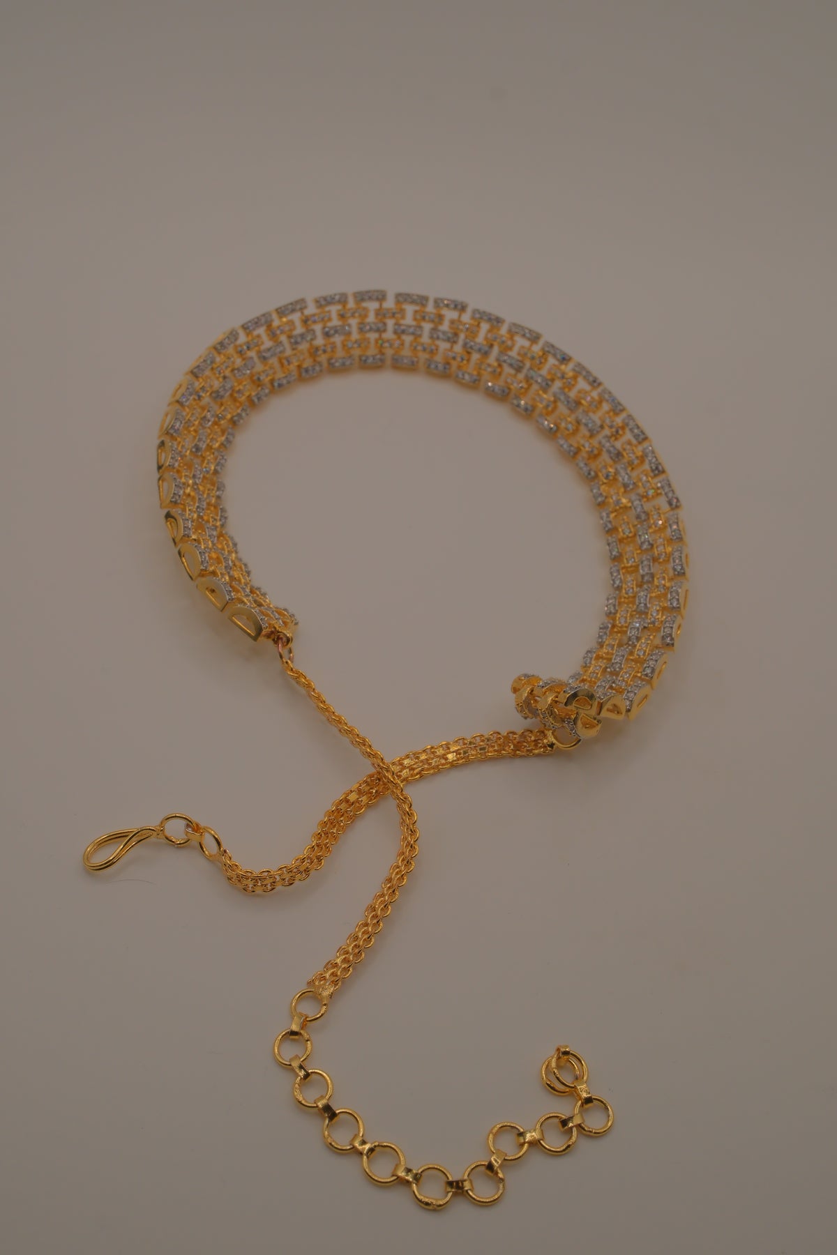 Multi-layered gold and cubic zirconia stones collar necklace