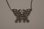 Antique brass-finished filigree butterfly bib necklace