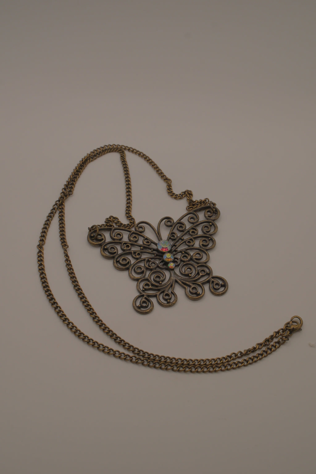 Antique brass-finished filigree butterfly bib necklace