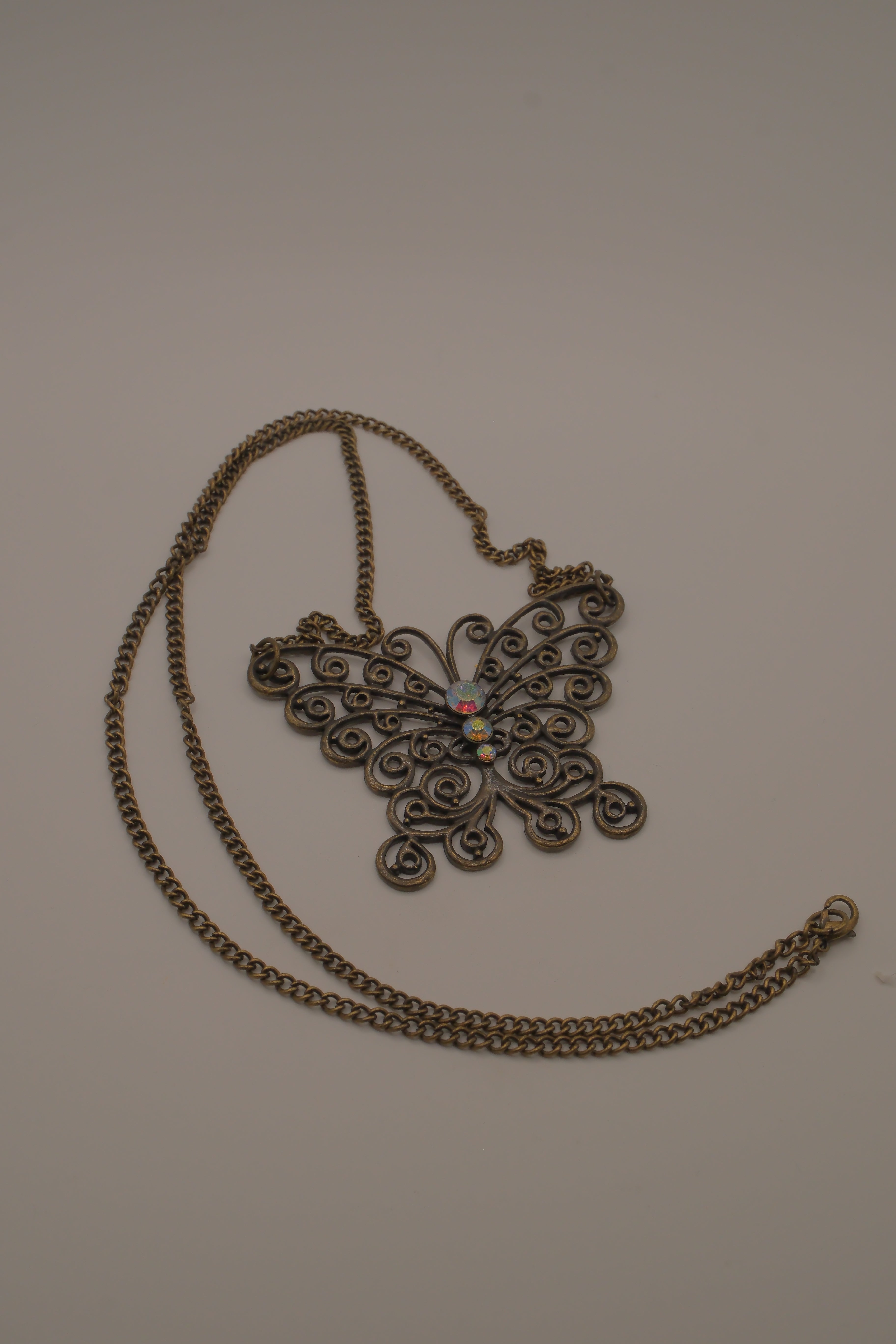 Antique brass-finished filigree butterfly bib necklace