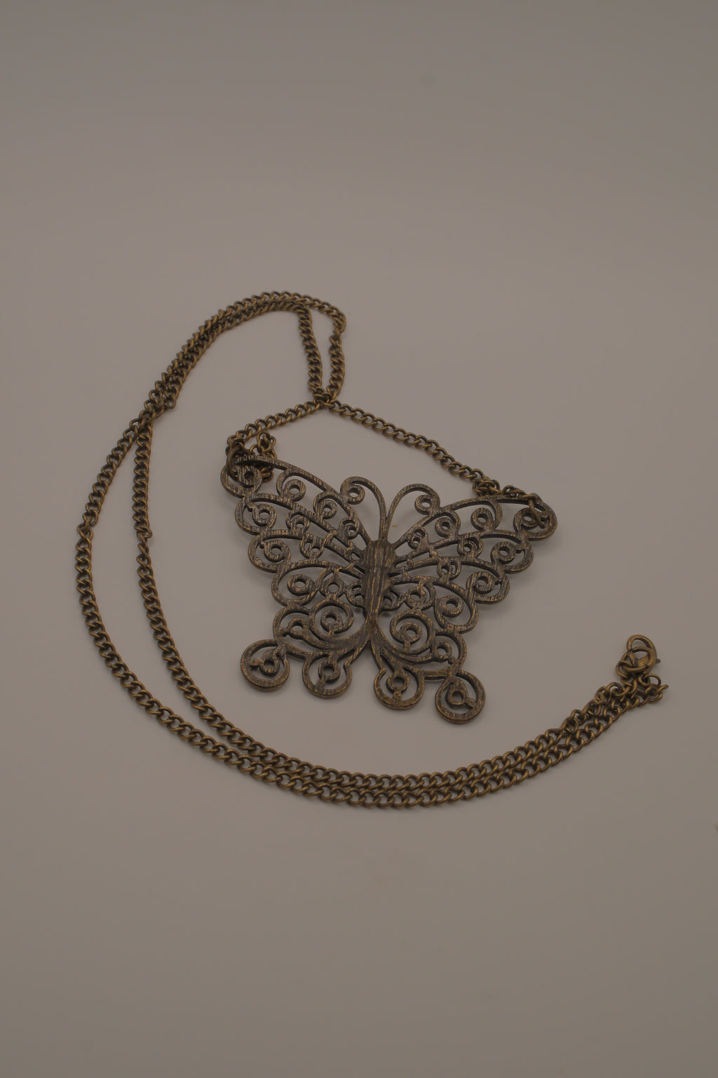 Antique brass-finished filigree butterfly bib necklace