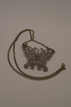 Antique brass-finished filigree butterfly bib necklace