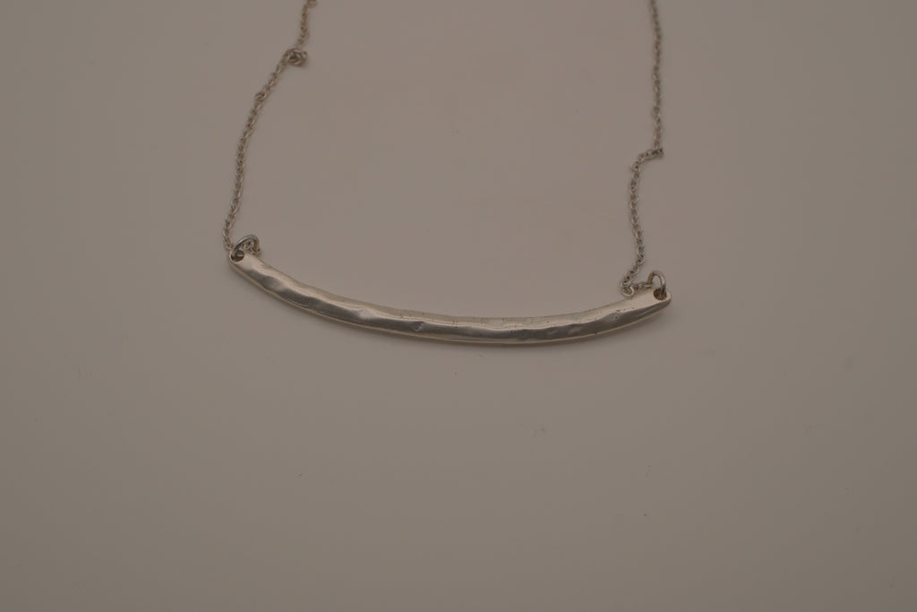 Silver tone curved bar necklace