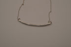 Silver tone curved bar necklace