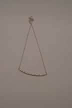 Silver tone curved bar necklace