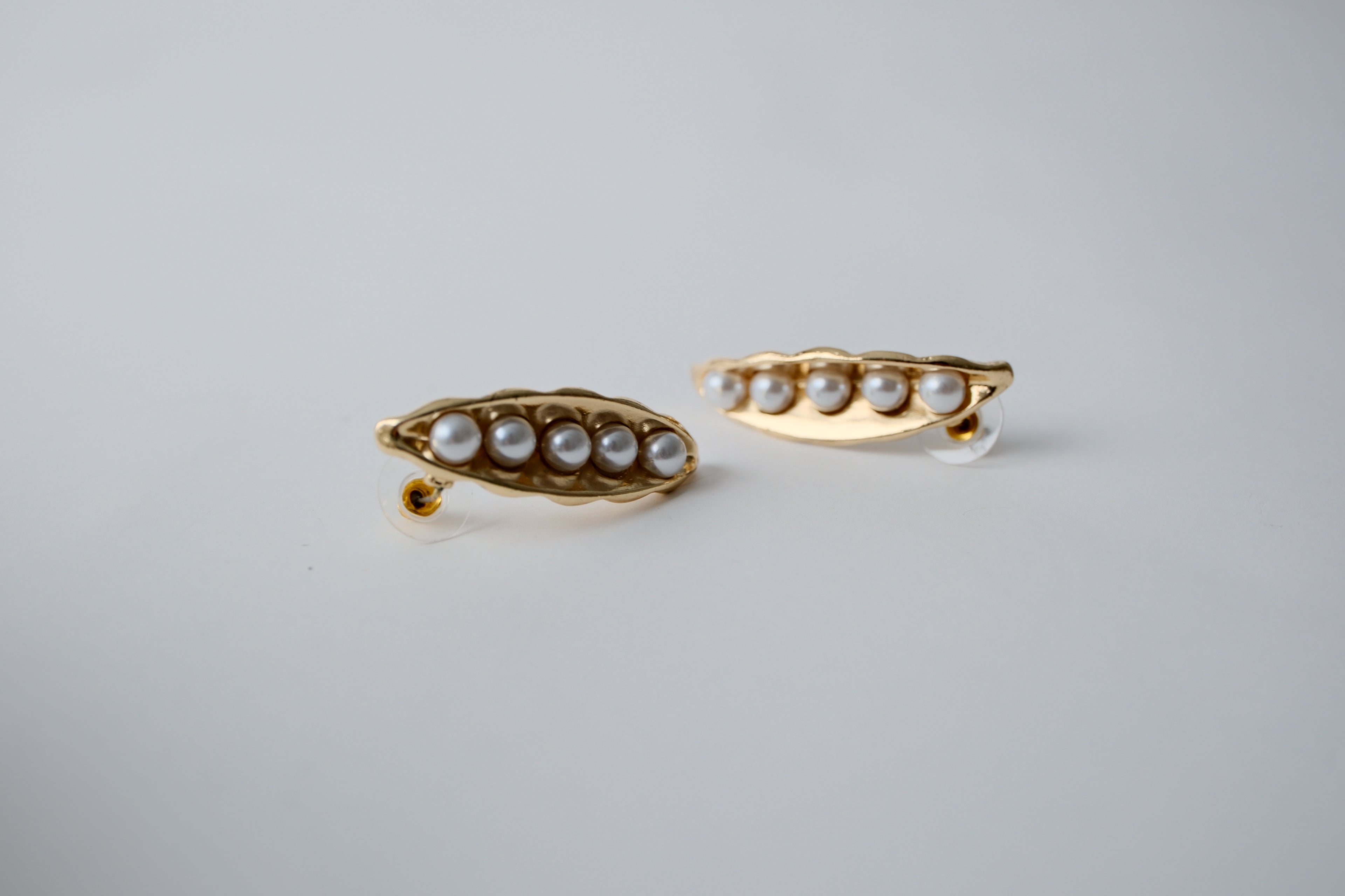 Schiaparelli inspired gold pea style earrings