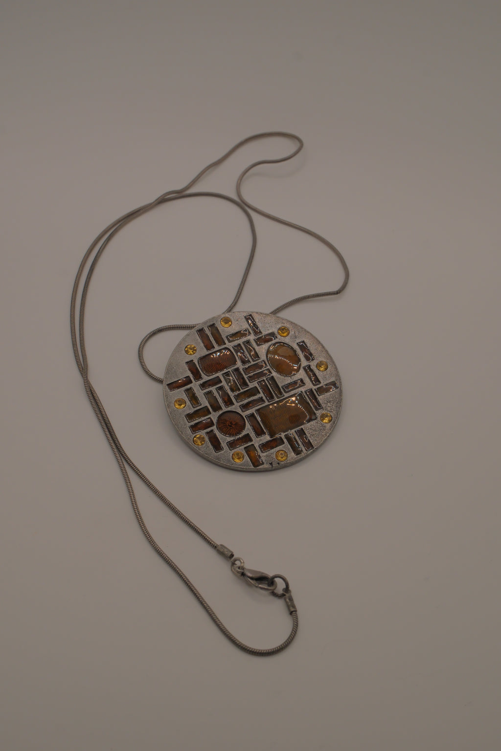 Hammered Silver Pendant with Golden Topaz Enameled Geometric Shapes