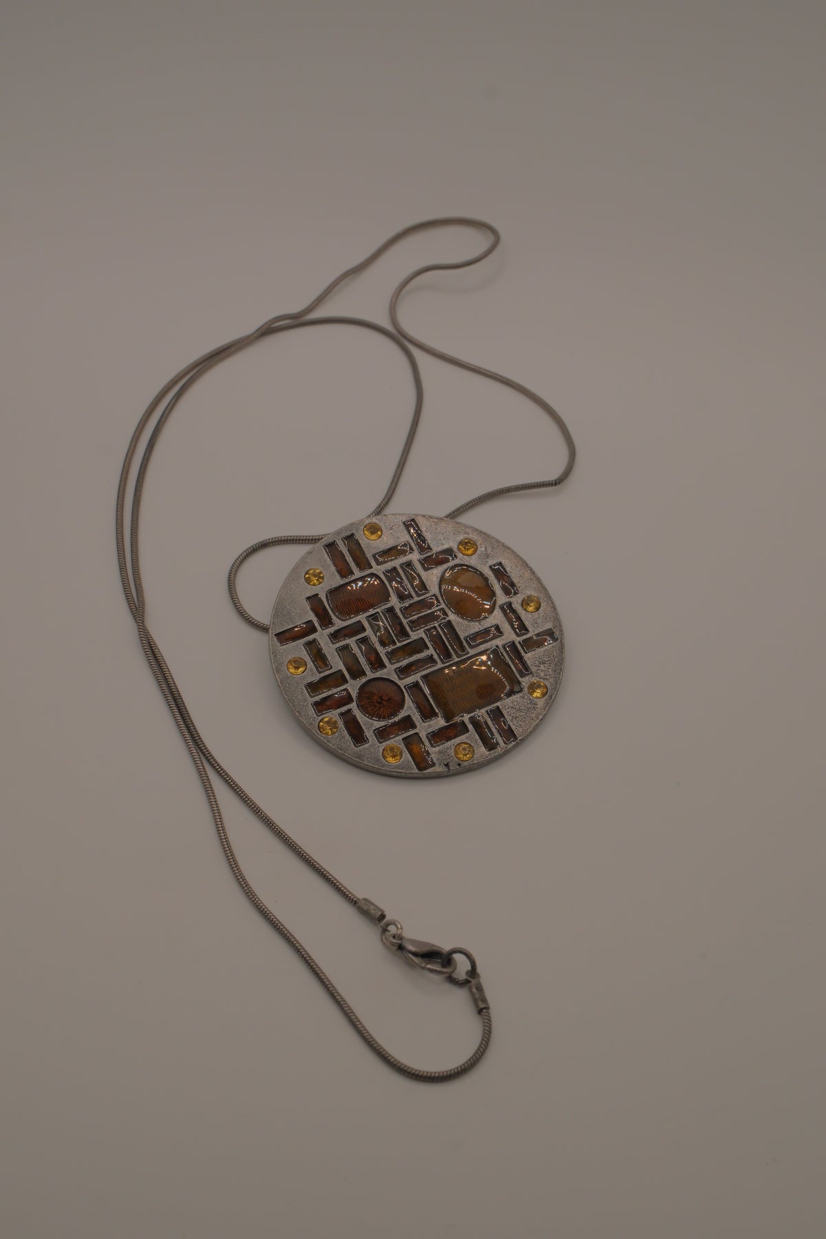 Hammered Silver Pendant with Golden Topaz Enameled Geometric Shapes