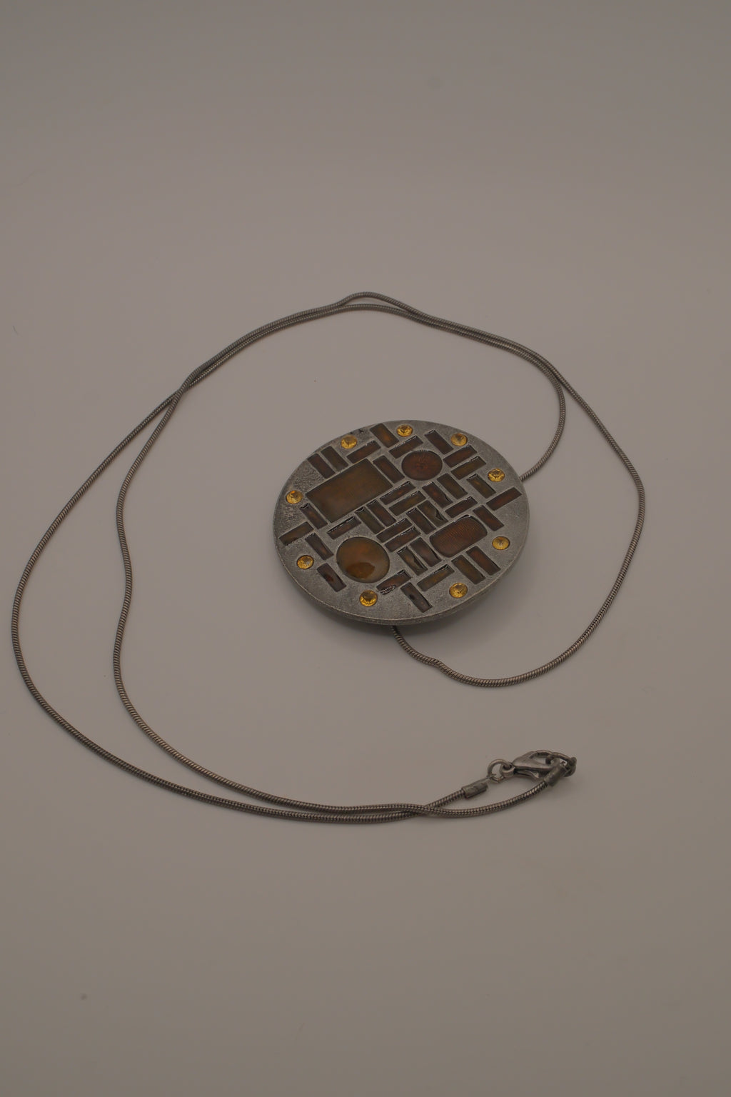 Hammered Silver Pendant with Golden Topaz Enameled Geometric Shapes