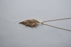 Gold Tone Feather Pendant Pave Articulated Necklace